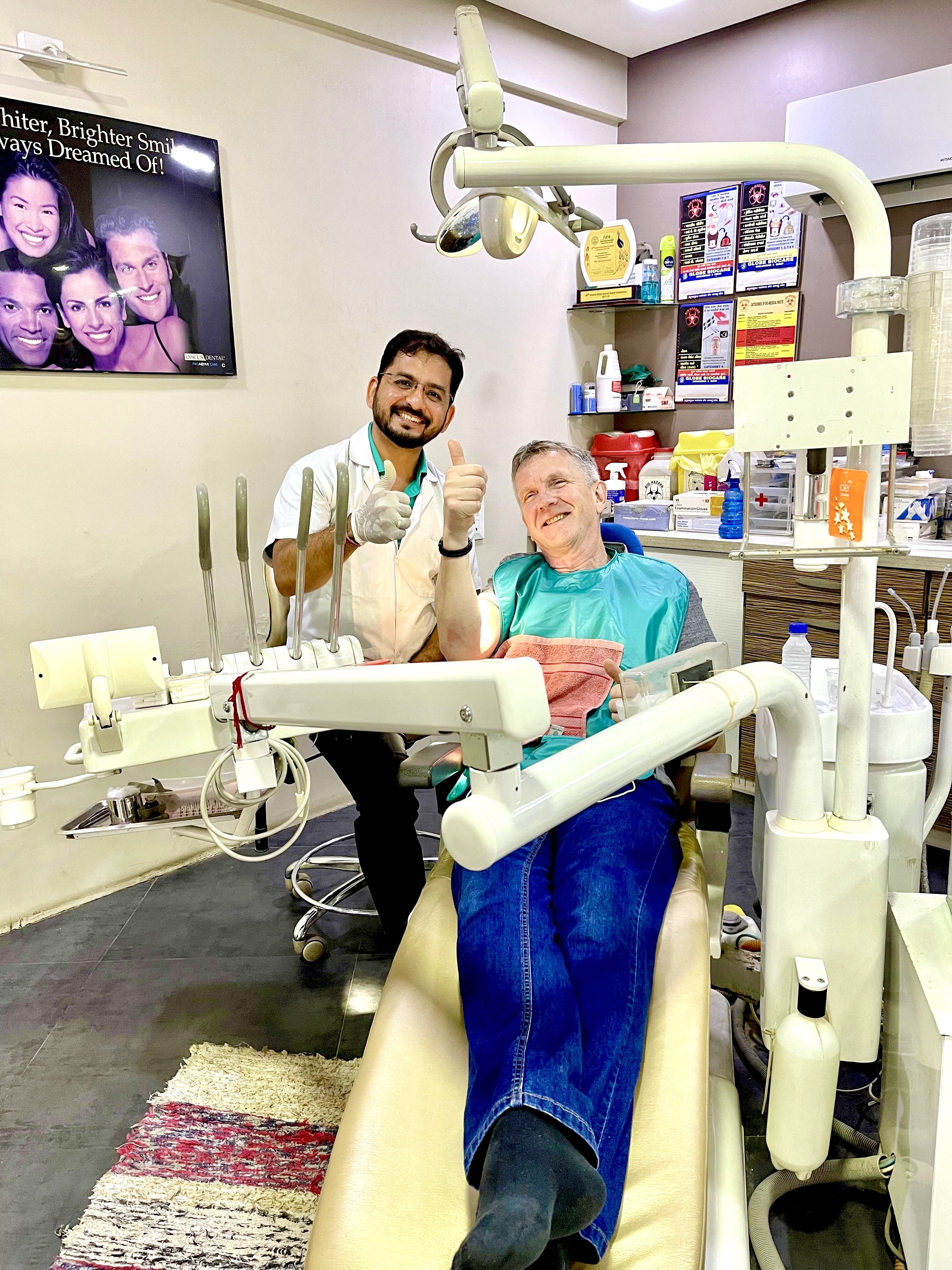 Dr. Kevin Gandhi with a patient after dental care at Gandhi Dental Clinic
