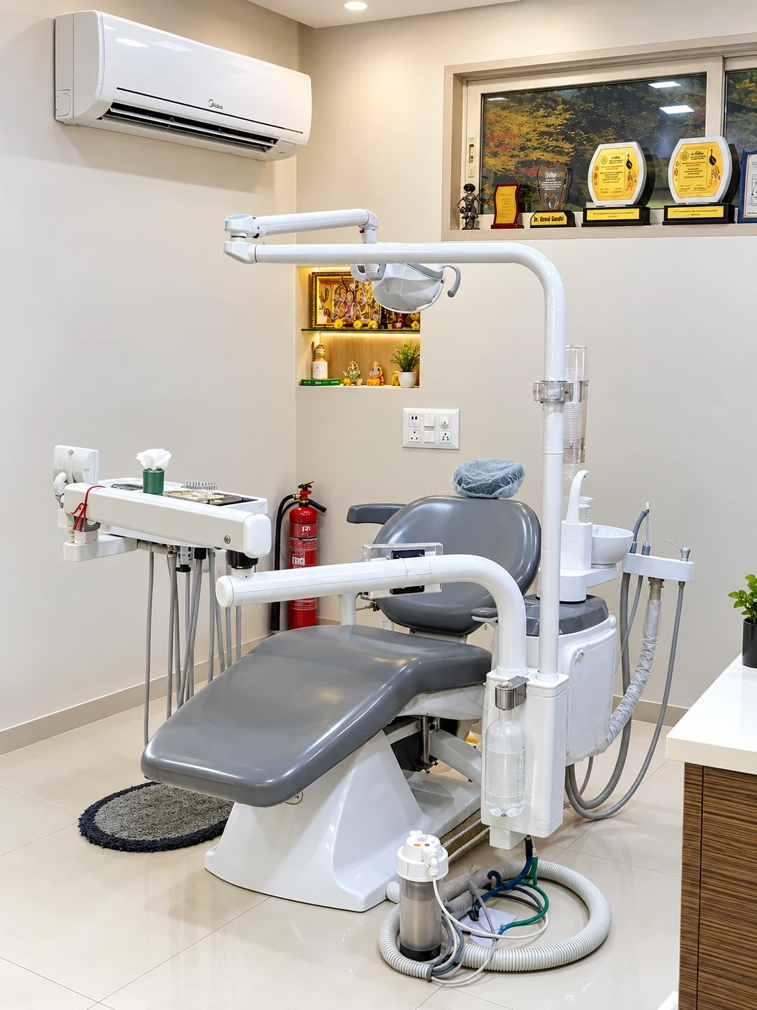 Grey dental treatment chair in a calm clinical room